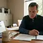 Open notebook with AI governance checklist next to a laptop showing a church management dashboard